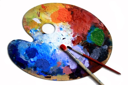 Palette with paint and brushes