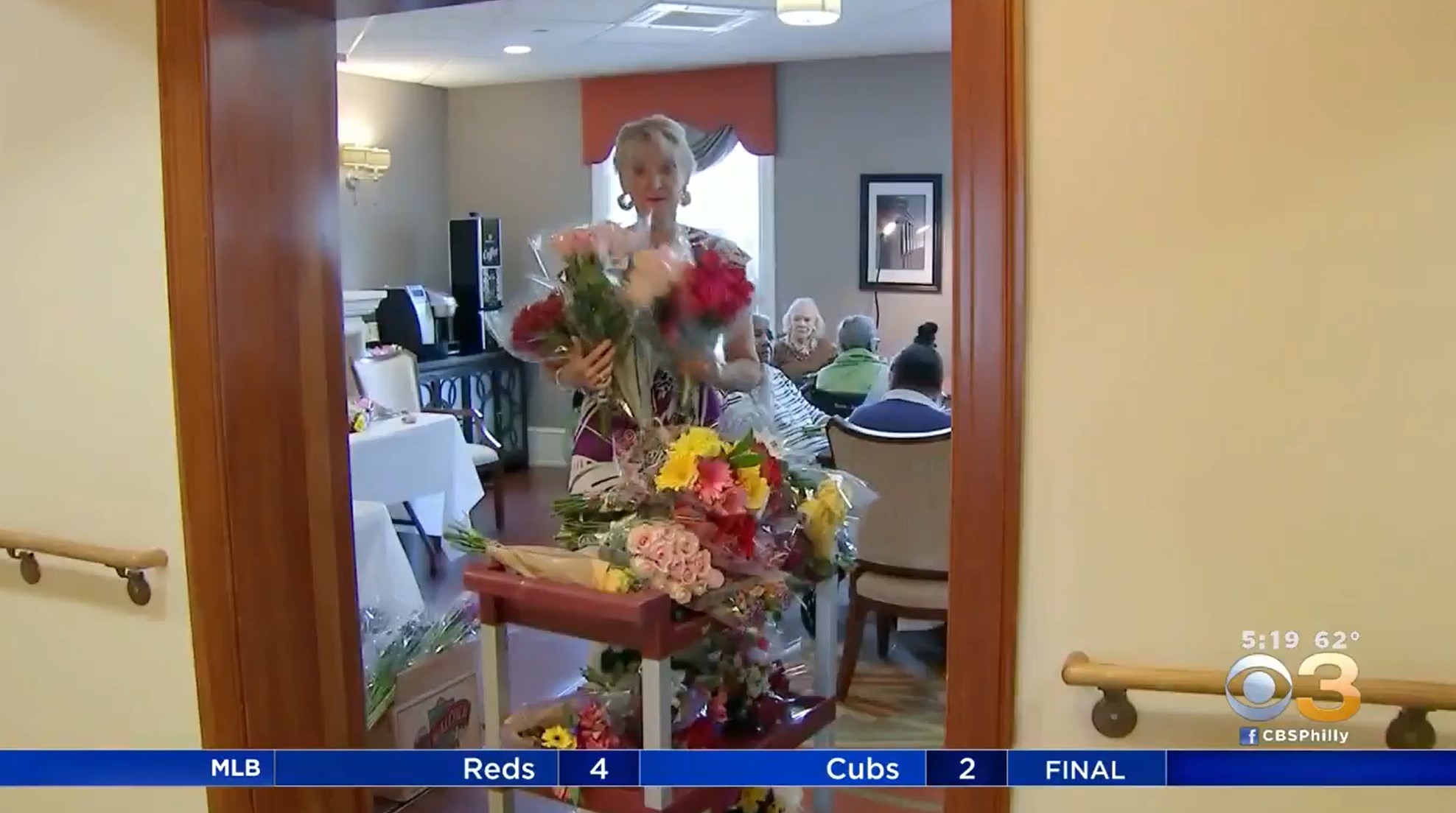 woman delivering flowers to senior residents