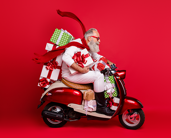 Santa on a motorcycle with presents