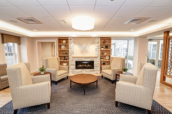 Lobby area with fireplace and chairs