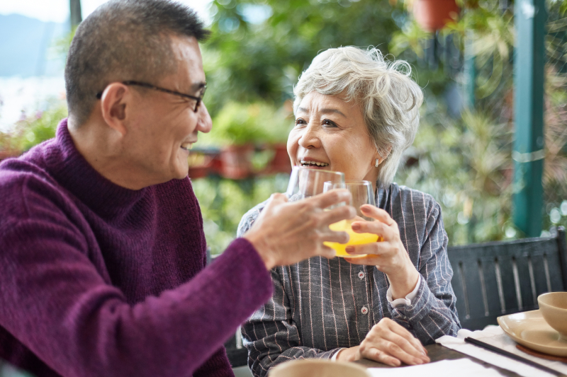 AffordabilityAsian Couple Toasting IStock-1221036742 (1)