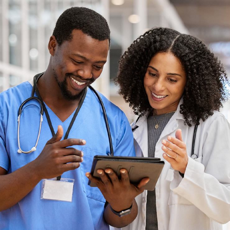 male and female nursing staff viewing tablet together