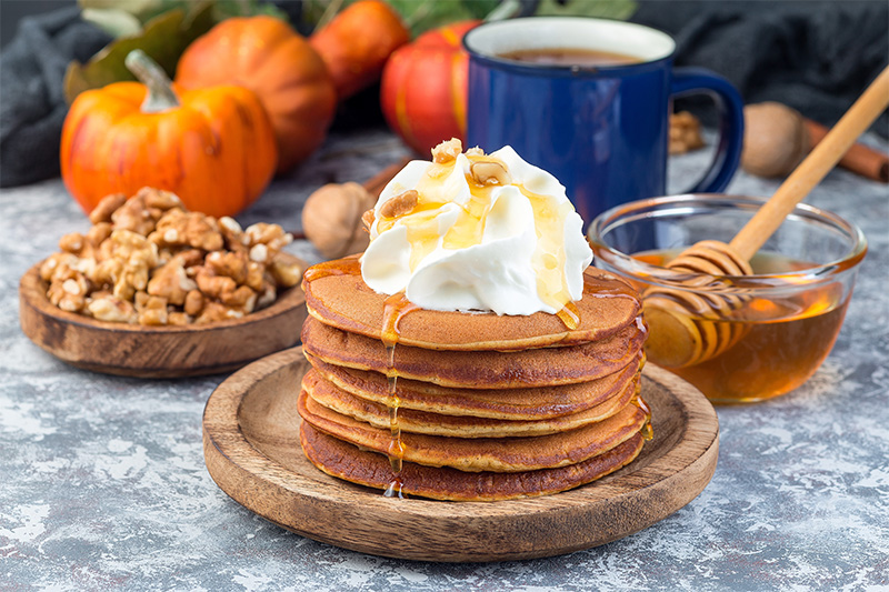 Fall Pumpkin Pancakes topped with whipped cream